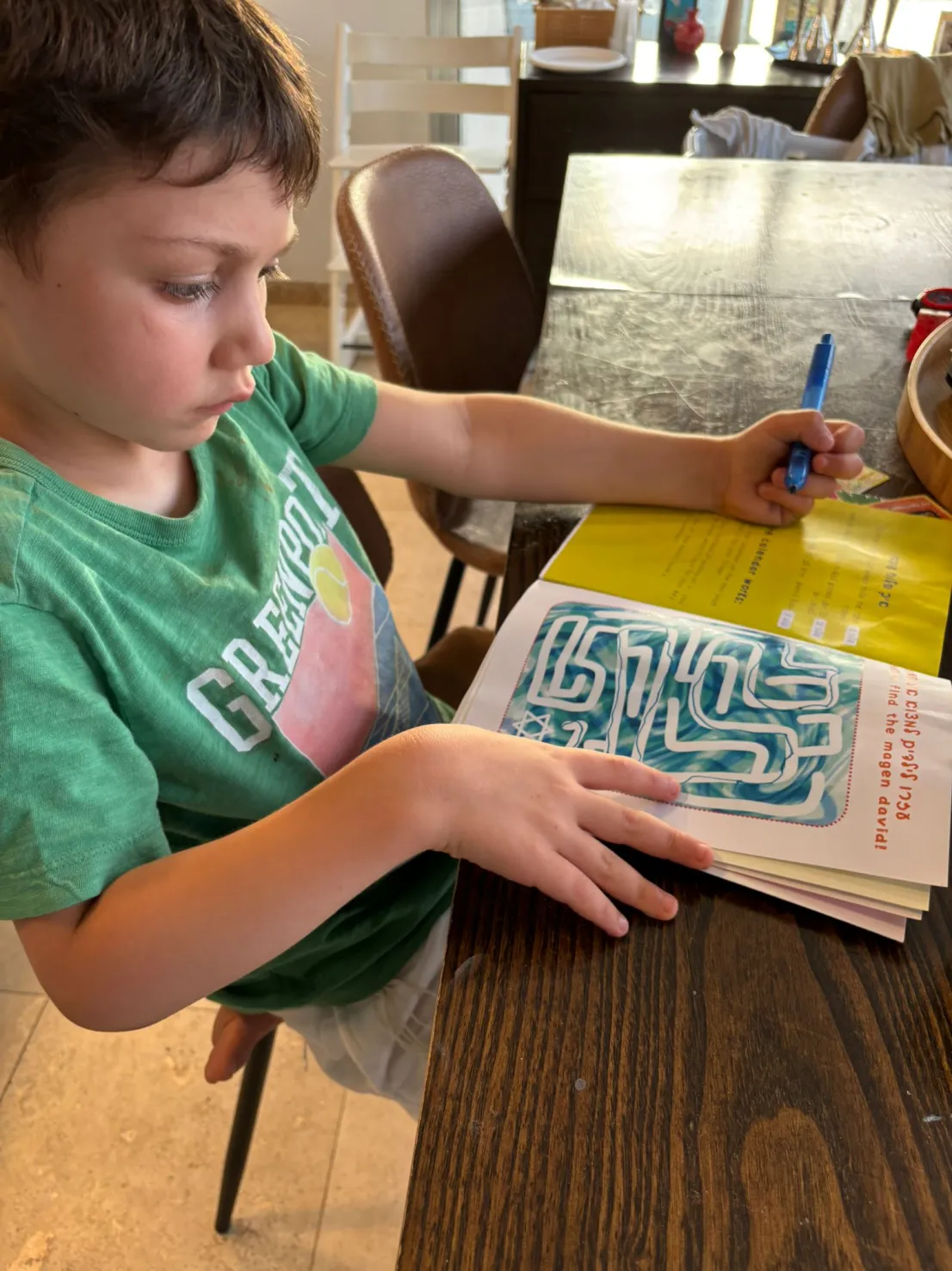 Boy completing the magen david maze